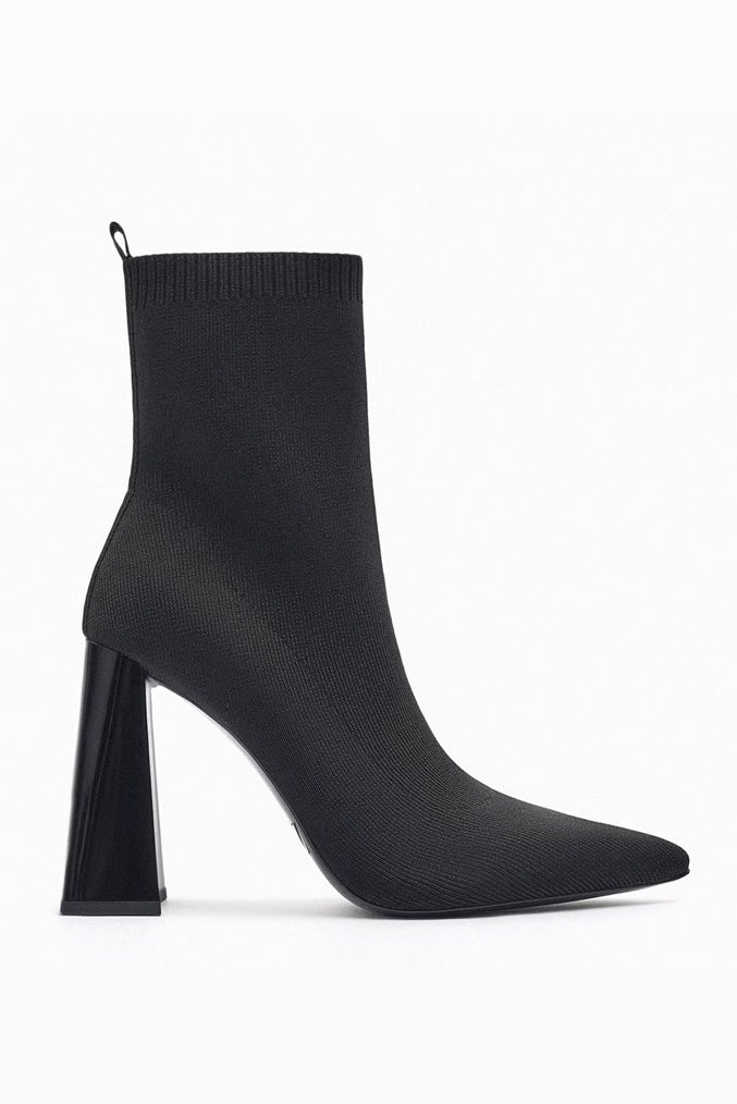 Black - Women's black ribbed knit ankle sock boots featuring a pointed toe and a shiny block heel.