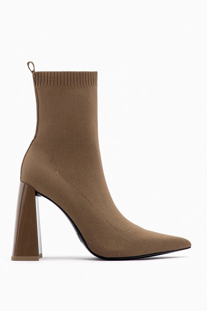 Brown - Women's black ribbed knit ankle sock boots featuring a pointed toe and a shiny block heel.