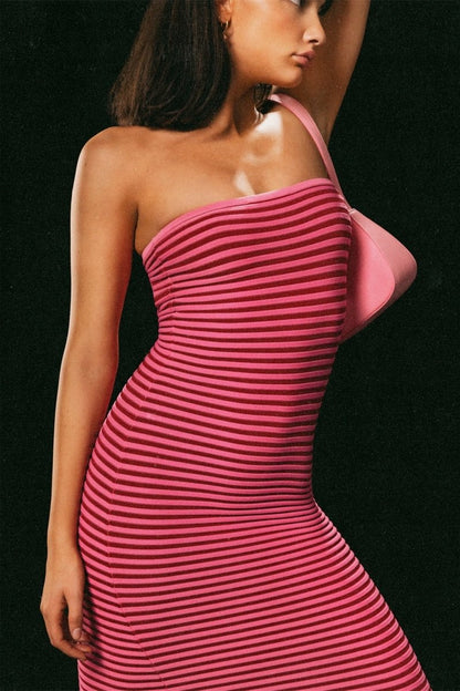 Hot Pink - A woman modeling a strapless knit maxi dress featuring a fitted column silhouette and an all-over horizontal stripe pattern.