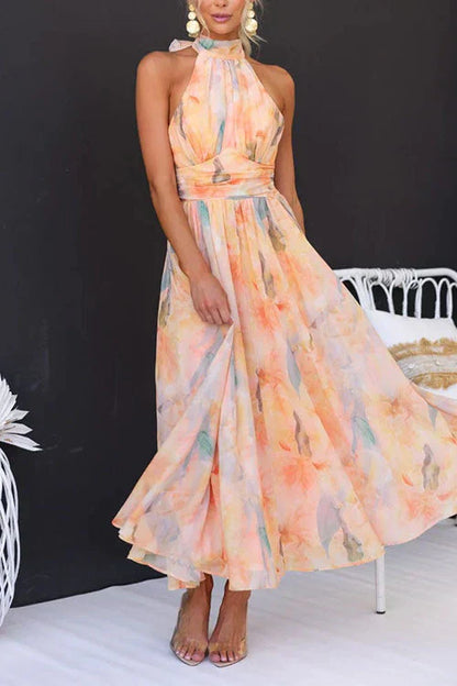 Multicolor - Women's elegant halter neck maxi dress featuring a wide ruched waistband and a flowing skirt in a pastel watercolor floral print.