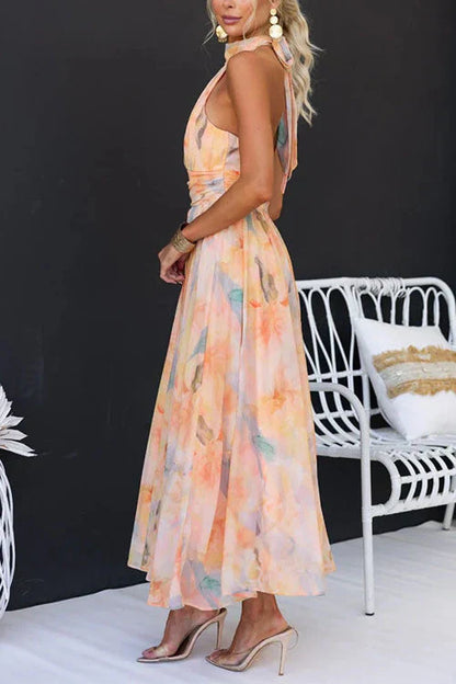 Multicolor - Women's elegant halter neck maxi dress featuring a wide ruched waistband and a flowing skirt in a pastel watercolor floral print.