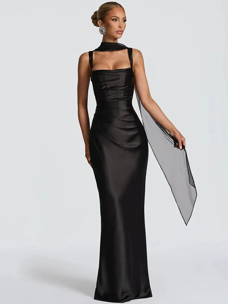 Black - Women's elegant olive green satin slip dress featuring a cowl neckline, ruched bodice, wide straps, and a matching neck scarf detail, styled for a formal event.