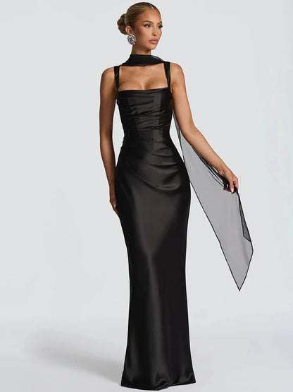 Black - Women's elegant olive green satin slip dress featuring a cowl neckline, ruched bodice, wide straps, and a matching neck scarf detail, styled for a formal event.
