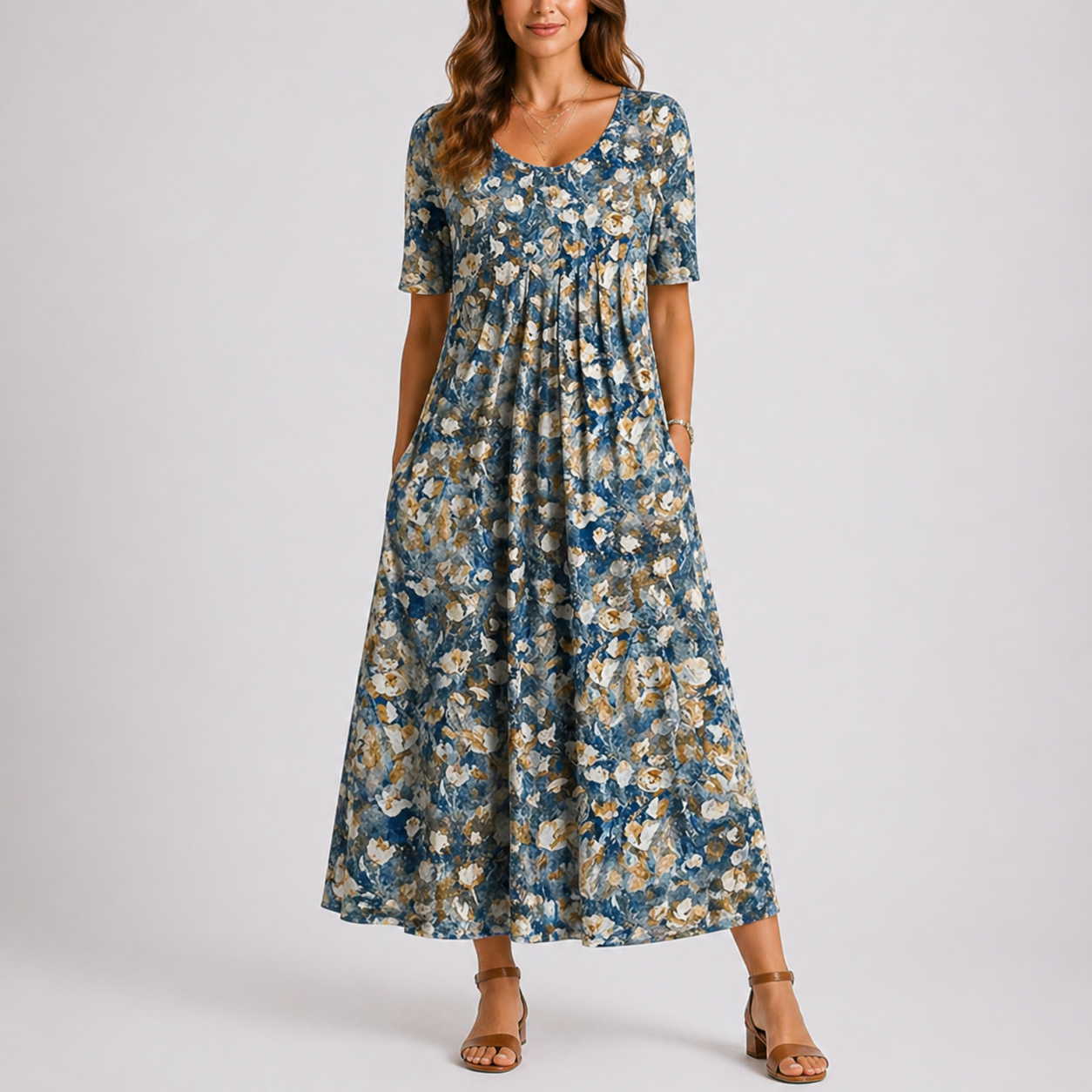 Baby blue - Model wearing a printed short-sleeve midaxi dress with a scoop neckline, gathered waist, and side pockets, standing against a plain light grey background.