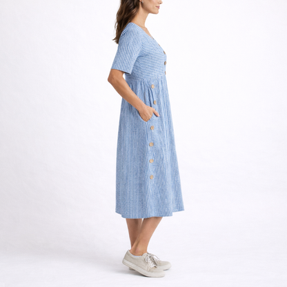 Blue - Model wearing a striped short-sleeve midi dress with asymmetric button detailing and side pockets against a plain background
