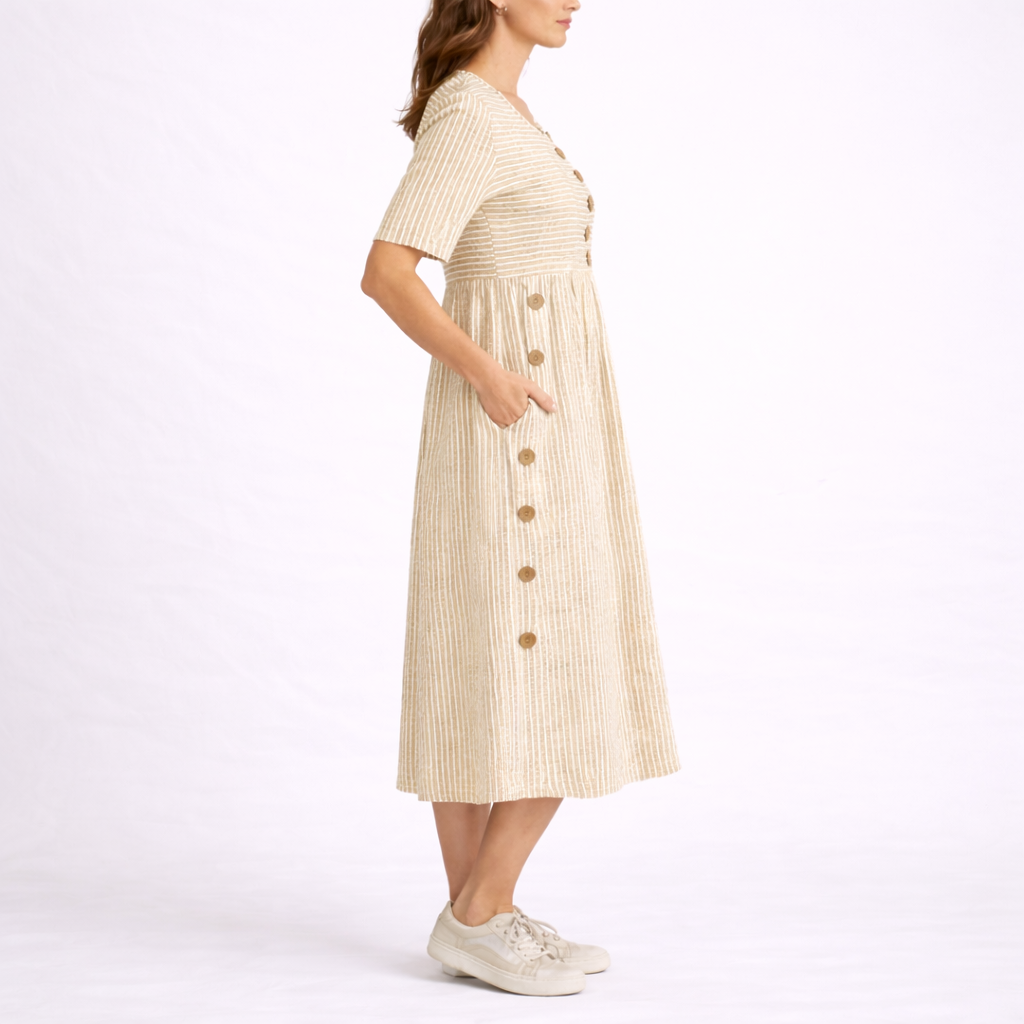 Beige - Model wearing a striped short-sleeve midi dress with asymmetric button detailing and side pockets against a plain background